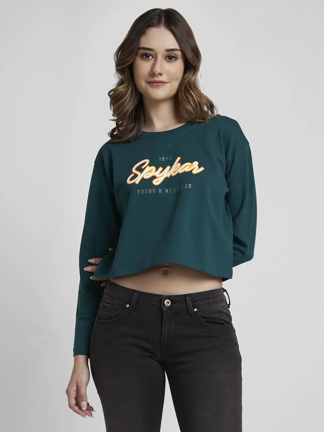 Spykar Women Marine Teal Blended Boxy Fit Round Neck Printed Crop Sweatshirt Feminine Women's Style Spykar Women Marine Teal Blended Boxy Fit Round Neck Printed Crop Sweatshirt Feminine Women's Style